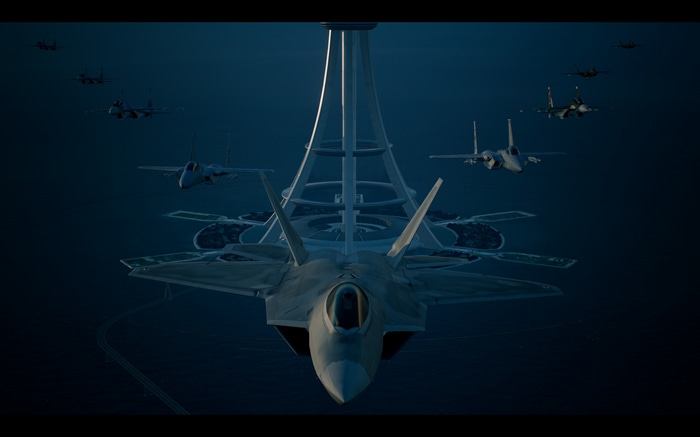 F-22 Raptors fly near a futuristic tower in Ace Combat 7