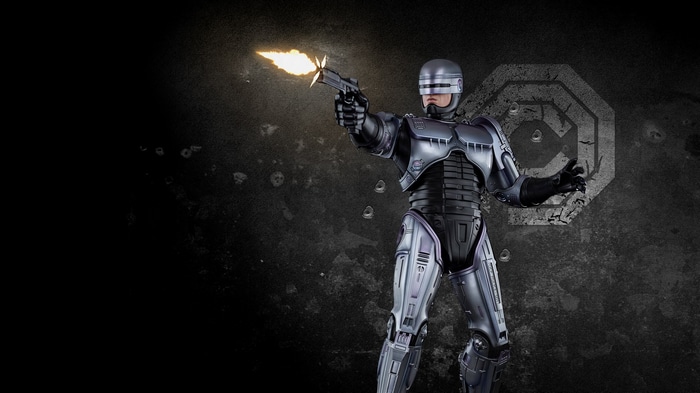 RoboCop firing his gun in front of a target