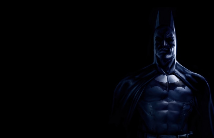 Batman in dark suit with Batman logo