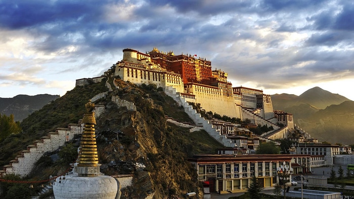 Potala Palace in Lhasa, Tibet, with mountains in the background