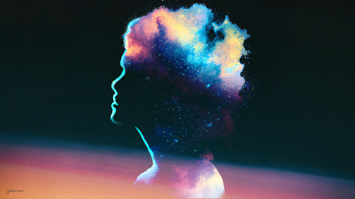 Silhouette of a head filled with colorful cosmic dust
