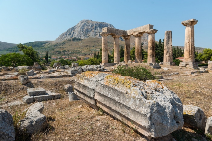 Ancient ruins of Corinthia, Greece with a mountain in the background