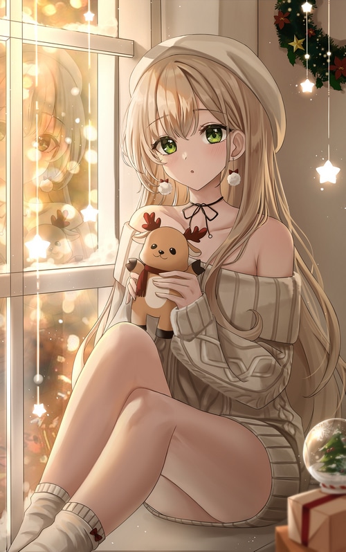 Girl with blonde hair and green eyes holding a reindeer plush
