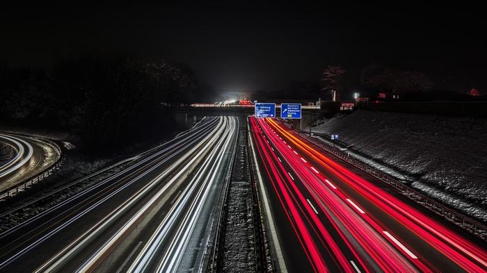 4K Long Exposure Night Highway with Light Trails and Snow