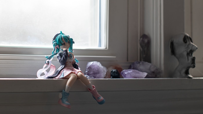 Hatsune Miku figure with amethyst crystals