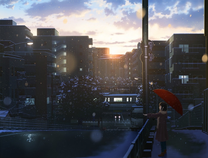 Girl with umbrella in a snowy city at sunset