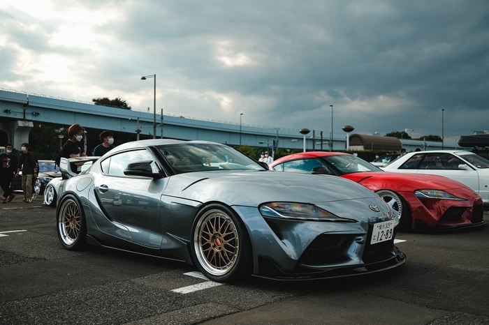 Toyota Supra at a car meet with other cars