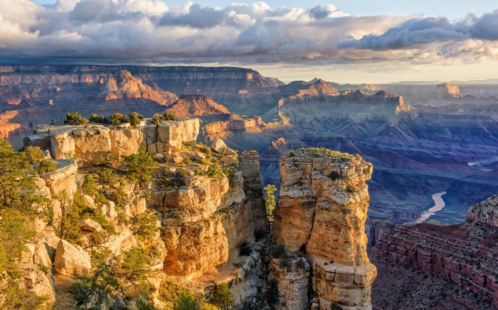Grand Canyon landscape with river and clouds