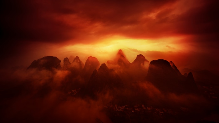 4K aerial view of Guilin mountains and city at sunset
