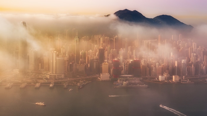 4K aerial view of Hong Kong cityscape in mist