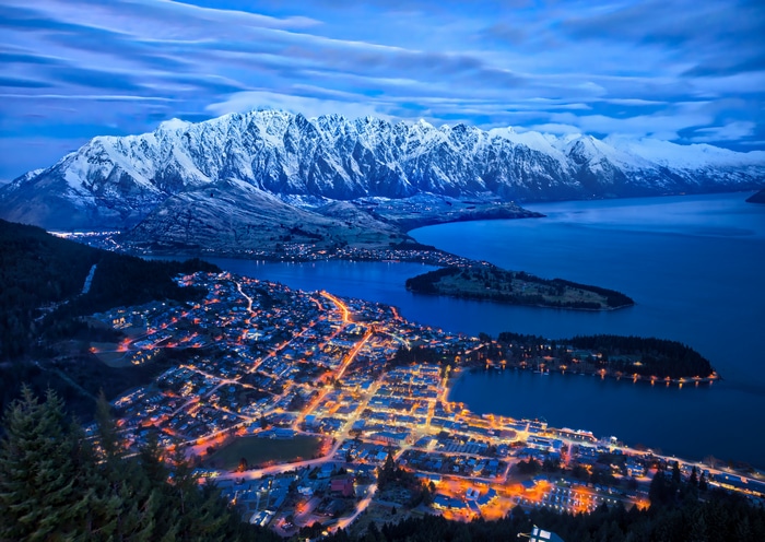 Queenstown New Zealand City Lights and Snow-Capped Mountains