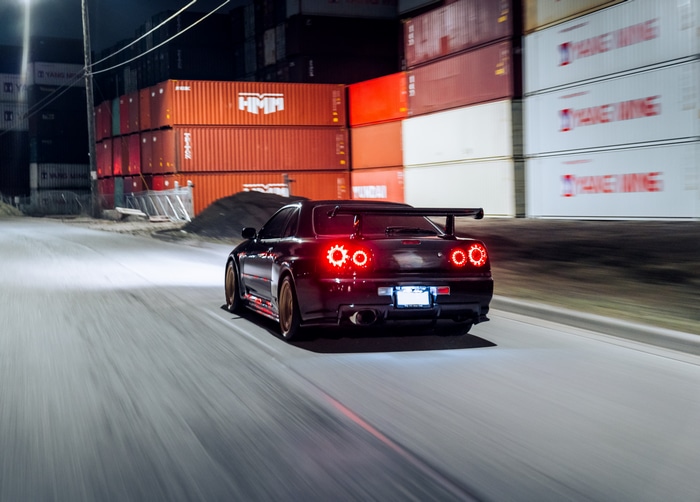 4K Nissan Skyline R34 with glowing taillights