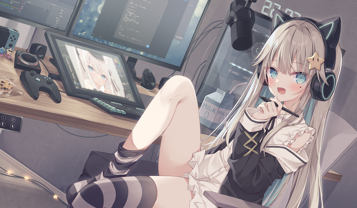 Anime girl with cat ears and headphones drawing on computer
