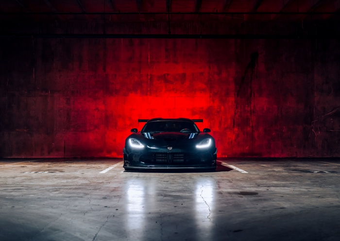 Dodge Viper with racing spoiler in a garage