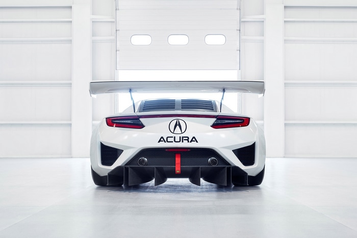 Acura NSX GT3 race car in a garage
