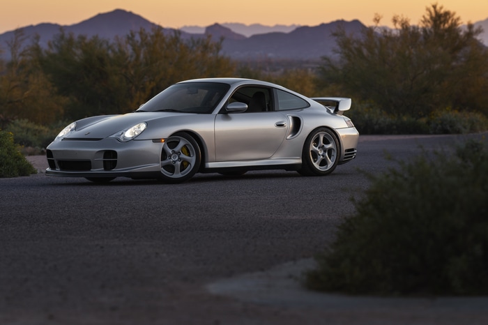 Silver Porsche 911 GT2 in a desert landscape