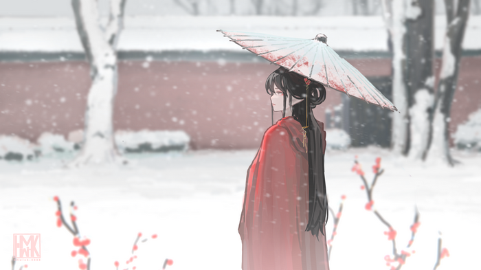 Woman in red holding an umbrella in the snow