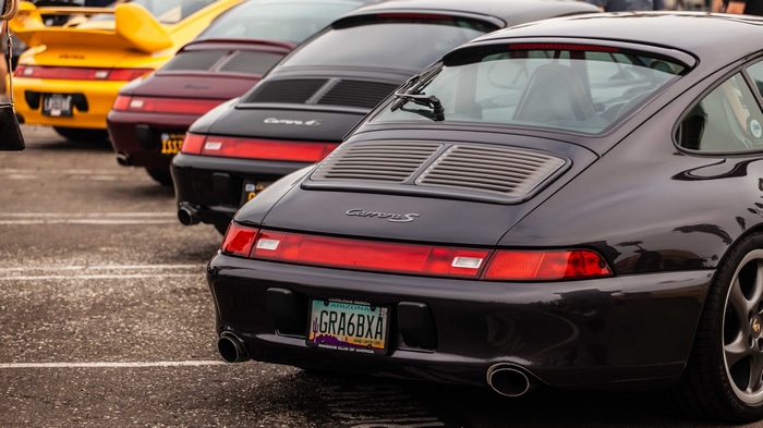 Porsche 993 Carrera S cars parked in a lot