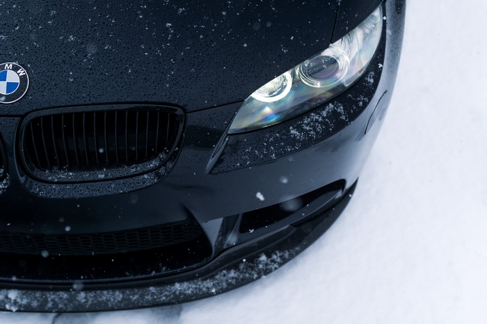 Black BMW car in the snow