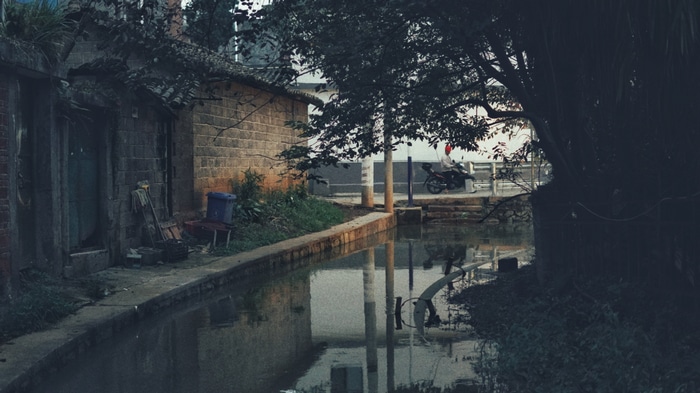 Canal in a Chinese town with reflections