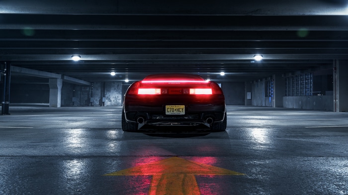 Honda NSX parked in a dark parking garage