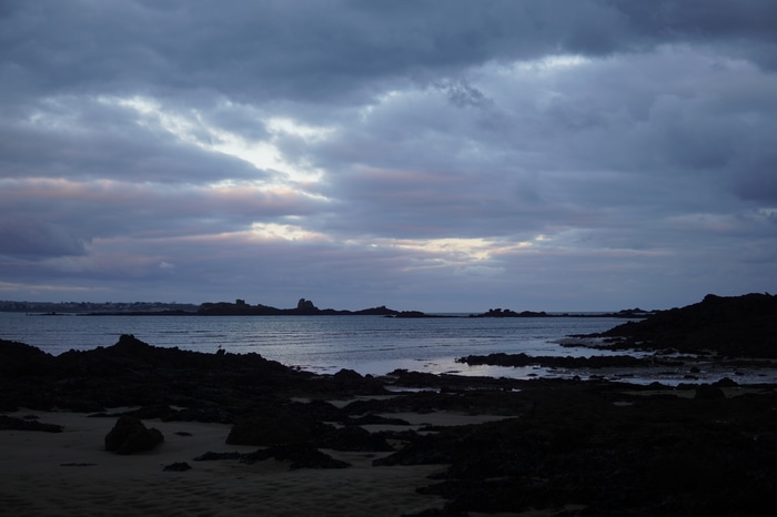 Brittany coast with rocky shore and cloudy sky