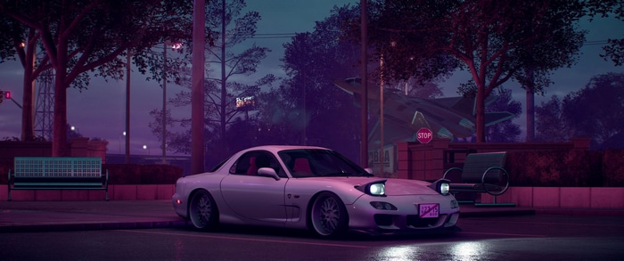 White Mazda RX-7 parked at night