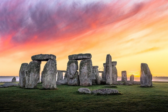 Stonehenge at sunrise with colorful sky