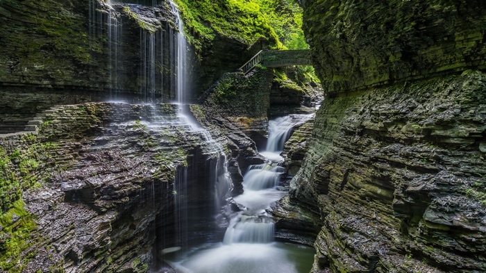 Waterfall cascading through a mossy canyon in the USA