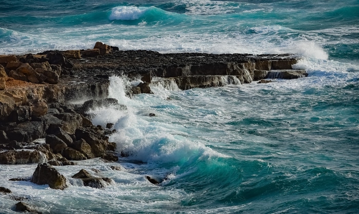 Waves crashing on rocky shore