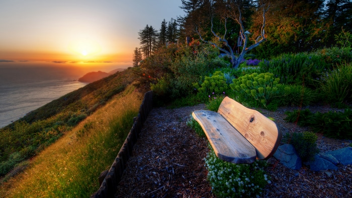 4K Sunset Overlooking the Ocean from a Garden Bench