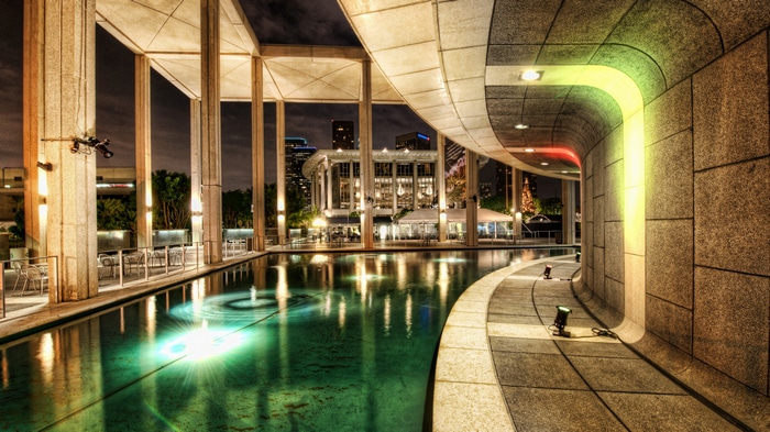 Night view of a modern building with a pool