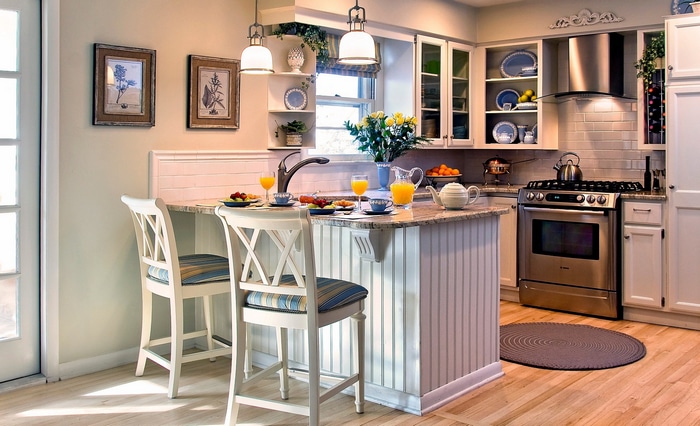 Kitchen island with breakfast and pendant lamps