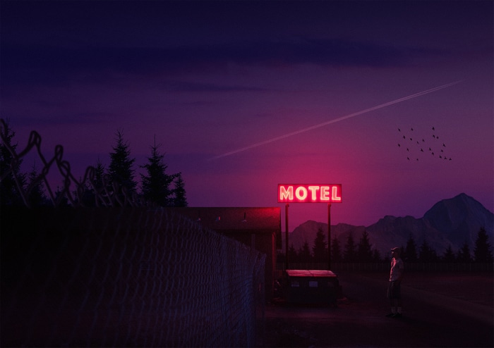 Motel neon sign at night with mountains