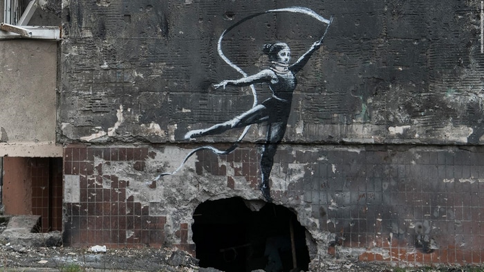 Banksy mural of a ballerina on a destroyed wall in Ukraine