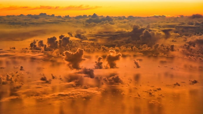 4K Clouds Over the Ocean at Sunset