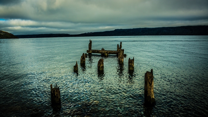 4K landscape of old wooden pier ruins in New Zealand