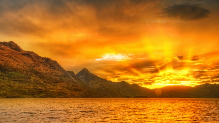 4K Sunset Glow Over Mountains and Water in New Zealand