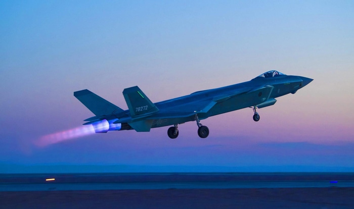 Chengdu J-20 fighter jet taking off at dusk