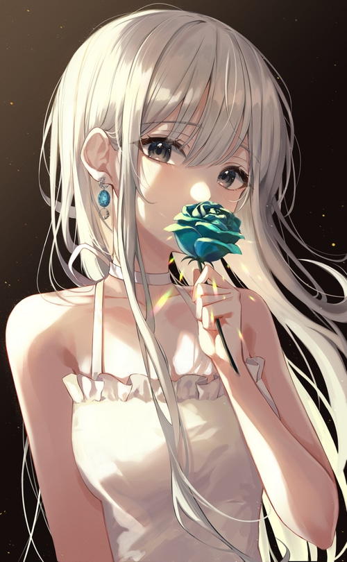 Girl holding a blue rose with an earring