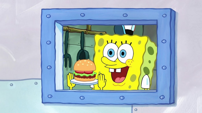SpongeBob SquarePants holding a Krabby Patty