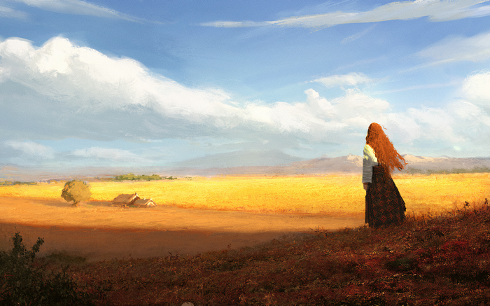 Woman with long red hair in a wheat field