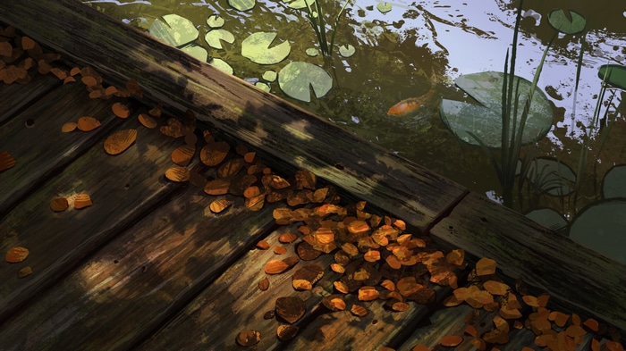Wooden dock with fallen leaves and koi fish in water