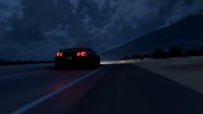 Nissan GT-R driving on a road at night in Forza Horizon 5