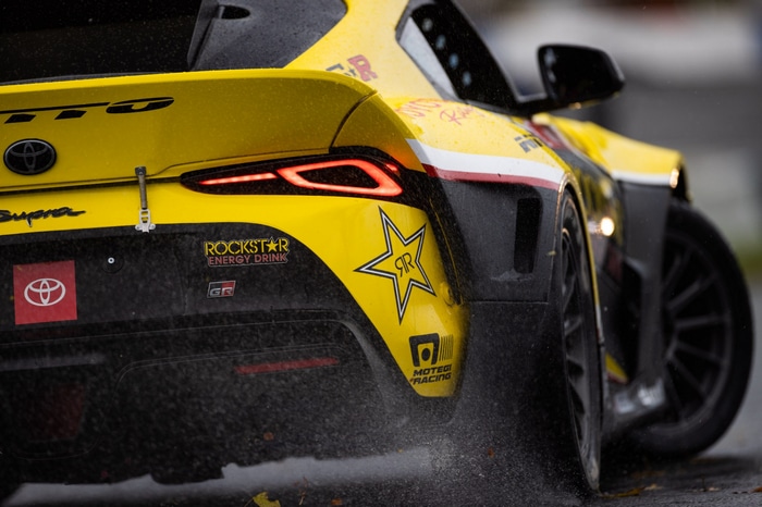 Yellow Toyota Supra race car with Rockstar Energy Drink sponsorship