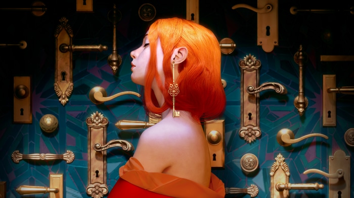 Fantasy art of a girl with orange hair and key earring