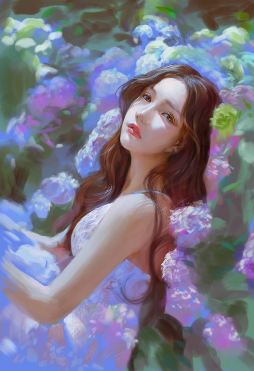 Woman with long brown hair among purple and blue flowers