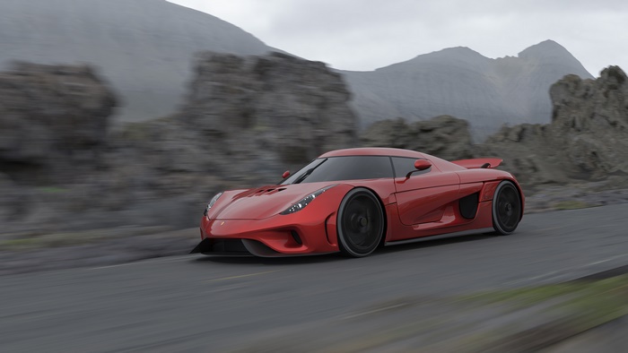 Red Koenigsegg Jesko driving on a road