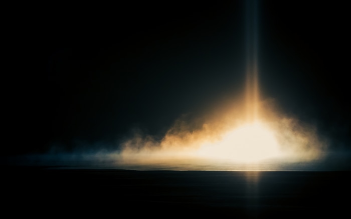 4K clouds over dark landscape