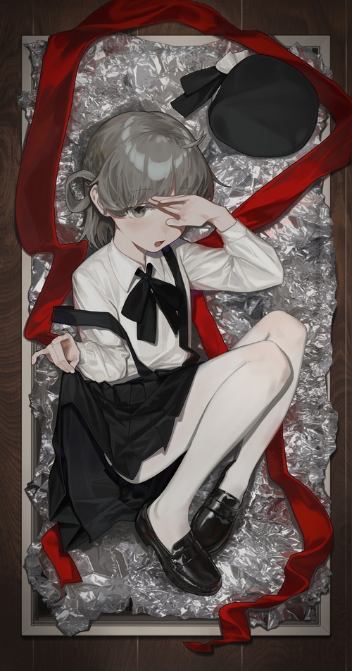 Girl in a box with red ribbon and hat